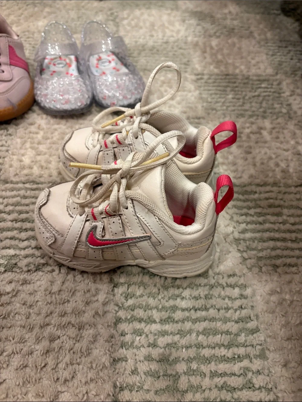 Nike Kids White Sneakers with Pink Swoosh and Accents